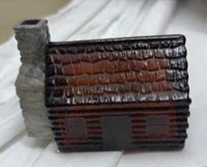 lot 714 image: Avon Wild Country Aftershave Ceramic Log Cabin Bottle with Stone Chimney - Empty