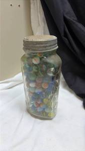 lot 738 image: Glass Marbles Collection in Mason Jar. (Some Glow Under UV Light)