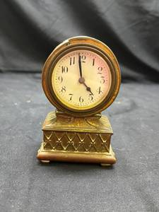 lot 780 image: Ornate Brass Mantel Clock with Decorative Base