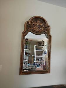 lot 910 image: Decorative Wall Mirror with Fleur de Lis on top.   52 x 29