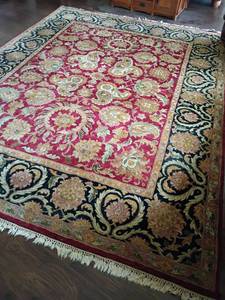 lot 915 image: Large Area Rug.  Located in Basement.  12ft  x 9ft.