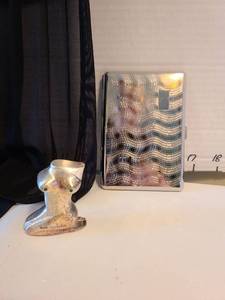 lot 1025 image: Vintage metal cigarette case with and cigarette lighter on shape of female torso