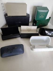 lot 1075 image: Empty designer glasses cases  Prada, Dior, Gucci, Oakley, Fendi, others