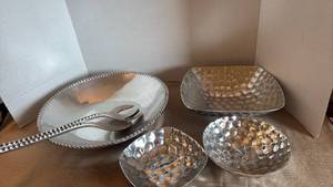 lot 1104 image: Salad bowl with serving utensils and hammered bowls