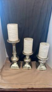 lot 1122 image: Silver Pillar Candle Holders Set of 3 tallest is 20 inches