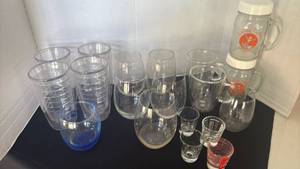 lot 1206 image: Mixed Glassware and Plastic with Measuring Cups and Drinking Glasses