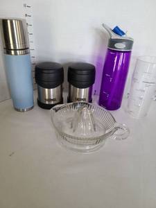 lot 1242 image: Starbucks thermos, Camelback bottle, 2 Thermos brand stainless food containers, glass citrus juicer
