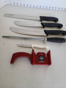 lot 1251 image: Wusthof knife sharpener and knives, one has tip broken off