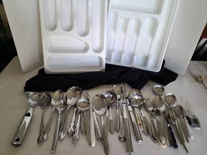 lot 1256 image: Serving spoons and forks, ice cream scoops, other flatware and 2 silverware drawer trays.