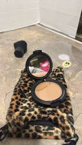 lot 1414 image: Julie Hewitt mini bronzer with brush and cheetah bag