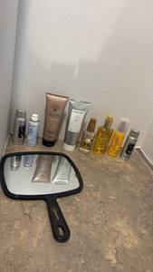 lot 1434 image: Mixed Hair Care Products Bundle with Black Hand Mirror along with setting spray