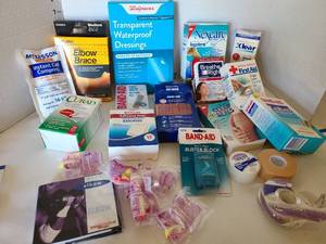 lot 1709 image: Bandaids, elbow brace, blister block, more