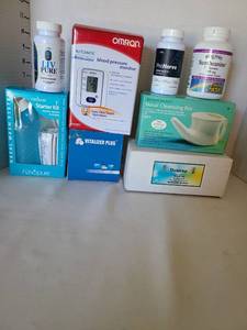 lot 1712 image: Blood pressure monitor, nasal cleansing pot, more