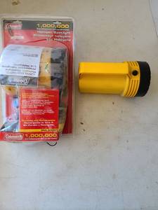 lot 3010 image: Coleman 1,000,000 Candlepower Halogen Spotlight with Eveready flashlight