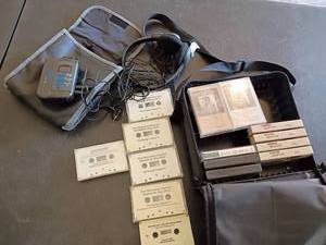 lot 3434 image: Cassette Tapes with Case, Player, Glasses and Headphones.