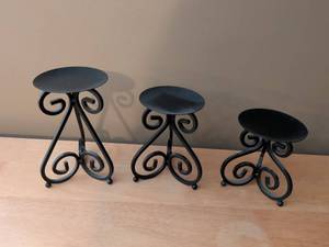 lot 30 image: Set of Three Black Metal Candle Holders with Scrollwork Design
