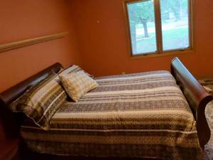 lot 69 image: Full Size Wood Sleigh Bed Frame with Brown Striped Bedding Set