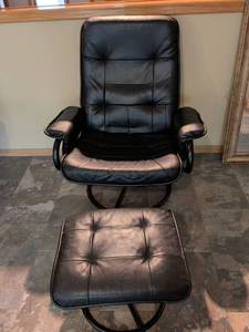 lot 82 image: Black Leather Swivel Recliner Chair with Ottoman