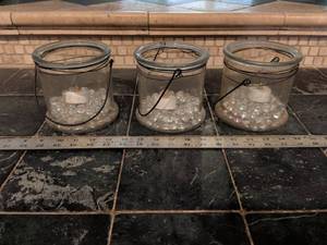 lot 215 image: Glass Jar Floating Candle Holders with Wire Handles Set of 3