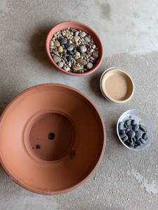 lot 310 image: Terracotta Plant Pot with Drainage Hole and Decorative Stones