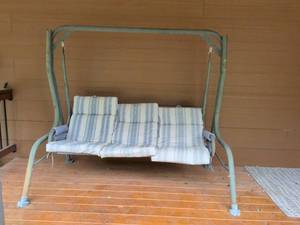 lot 468 image: Three Seat Outdoor Patio Swing with Striped Cushions