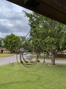 lot 478 image: Kinetic Metal Wind Spinner with Glass Globe Center