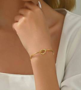 Gold Tone Open Cuff Bracelet with Knot Detail
