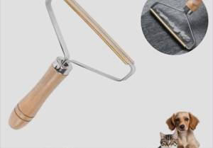lot 2831 image: Pet HairLint Remover Tool with Wooden Handle