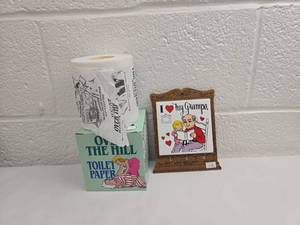 lot 181 image: Over The Hill Novelty Toilet Paper Roll and I Love My Grampa Picture Frame