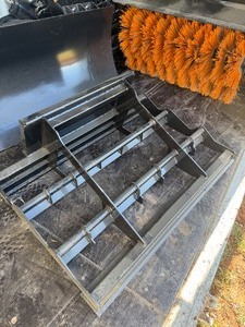 lot 5076 image: Unused SDLANCH Mini Skid Steer Land Leveler Attachment