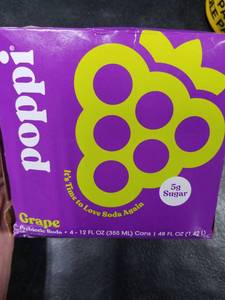 lot 2022 image: Poppi Grape Soda 4-12oz Cans BB 8.17.25 - Retail $0