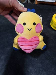 lot 4011 image: Small Dinosaur Holding a Heart Plush