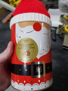 lot 7115 image: M&S Santa Claus Cookie Tin with Salted Caramel Chocolate Chunk Cookies
