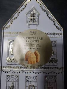 lot 7237 image: M&S Light Up Cookie Tin House Shaped Container