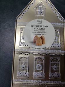 lot 7747 image: M&S Light Up House Shortbread Cookie Tin