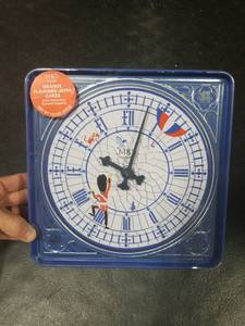 lot 8231 image: M&ampS Food Orange Flavored Jaffa Cakes with Working Clock Tin