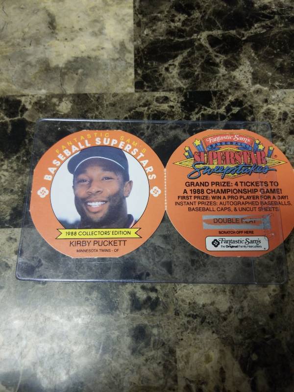 lot 548 image: 1988 Fantastic Sams Baseball Superstars Kirby Puckett Minnesota Twins Round Baseball Card