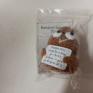 lot 7465 image: Positive Poo Support Doll