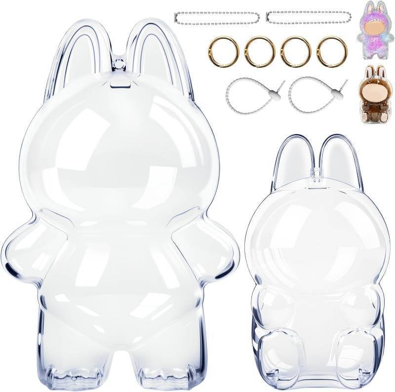 lot 4394 image: 2Pcs Protective Case for LAbubu Doll, Clear Display Case for Monsters Exciting Macaron Series, Case Cover with Have a Seat, Dustproof Case with Keychain Hook for Portable Hanging