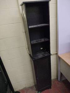 lot 52818 image: black freestanding tall linen tower with shutter-style cabinet door