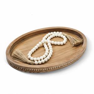 lot 566 image: 16 x 11.8 Oval Wood Decorative Tray with 58 Bead Garland, Farmhouse Coffee Table & Kitchen Island D�cor, Rustic Brown Entryway Console Tray for Styling, Candles & Small Items - Retail $30