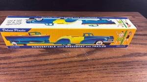 lot 40591 image: Deluxe Plastic Convertible with Speedboat and Trailer 143 Scale
