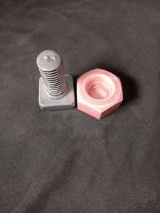 lot 40905 image: Ceramic Nut and Bolt Salt and Pepper Shaker Set