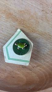 lot 40744 image: Collectible Enamel Pin Badge with Green Design