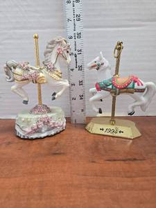 lot 373 image: Set of decorative carousel horse figurines.  1) Melodies County Fair Collection Music Box Dancer Heritage House 2) Tobin Fraley 1994 Hallmark Carousel Horse Figurine.