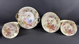 lot 34 image: Vintage Limoges Floral Pattern China Dinnerware with Gold Trim (1) Serving Plate 10 inch Diameter with Handles (11) Berry Bowls (11) Condiment Plates and (10) Bread and Butter Plates 7 inch diameter