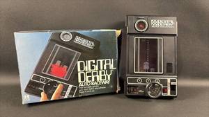 lot 47 image: Vintage TOMY Digital Derby Auto Raceway Handheld Electronic Game with Original Packaging