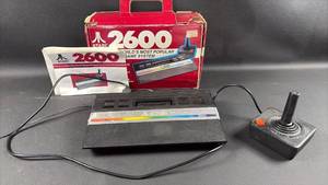 lot 48 image: FUN Atari 2600 Console System with Joystick Controller Powers Up.