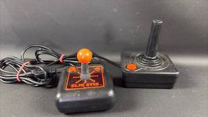 lot 49 image: Atari 2600 Slik Stik and Original Joystick Controllers