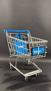 lot 134 image: Walmart Mini Shopping Cart with Mini Bag.  Handle Tops out at 9.5 Inches